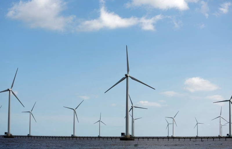 Power-generating windmill turbines are pictured at a wind park in Bac Lieu province, Vietnam, July 8, 2017. REUTERS/Kham/File Photo