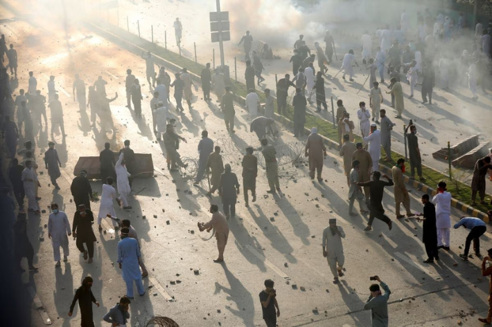 Supporters of Pakistan's former Prime Minister Imran Khan participate in a protest against his arrest, in Peshawar, Pakistan