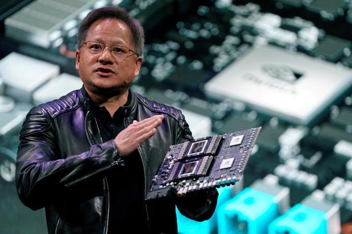 Jensen Huang, CEO of Nvidia, shows the Drive Pegasus robotaxi AI computer at his keynote address at CES in Las Vegas, Nevada, US