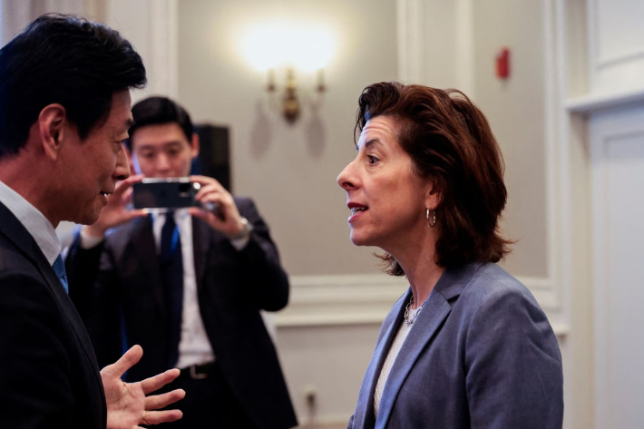 US Commerce Secretary Gina Raimondo talks to Japan's Minister of Economy, Trade and Industry Yasutoshi Nishimura during the Indo-Pacific Economic Framework meeting in Detroit, Michigan, US