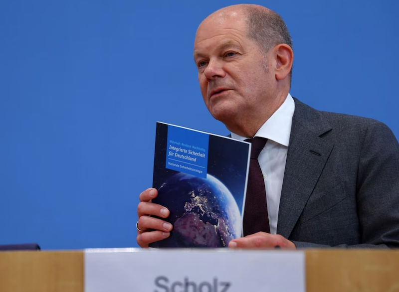 German Chancellor Olaf Scholz holds a document during a press conference on the day the cabinet presents the national security strategy at the House of 'Bundespressekonferenz' in Berlin, Germany June 14, 2023. REUTERS/Fabrizio Bensch