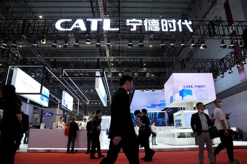 People walk past the booth of the battery manufacturer Contemporary Amperex Technology Co. Limited (CATL) at the Auto Shanghai show, in Shanghai, China April 18, 2023. REUTERS/Aly Song/File Photo