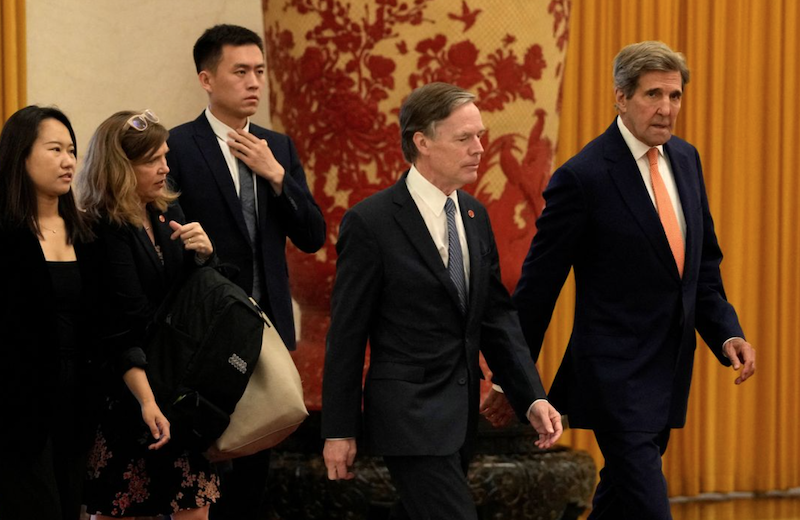 U.S. climate envoy John Kerry, at right walks next to U.S. Ambassador to China Nicholas Burns as they arrive for meetings at the Great Hall of the People in Beijing, Wednesday, July 19, 2023. Ng Han Guan/Pool via REUTERS
