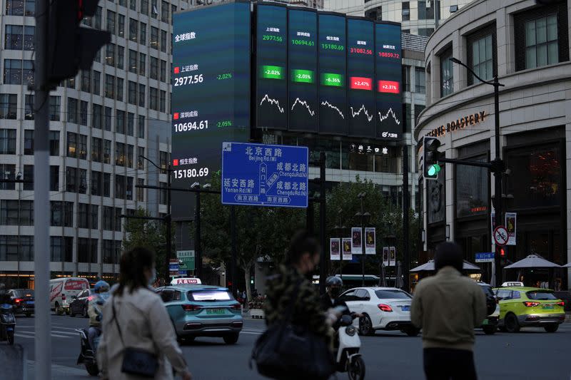 A giant display of stock indexes is seen in Shanghai