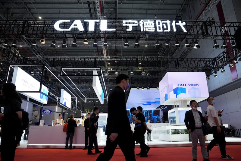 People walk past the booth of the battery manufacturer Contemporary Amperex Technology Co. Limited (CATL) at the Auto Shanghai show, in Shanghai, China April 18, 2023. REUTERS/Aly Song/File Photo Acquire Licensing Rights