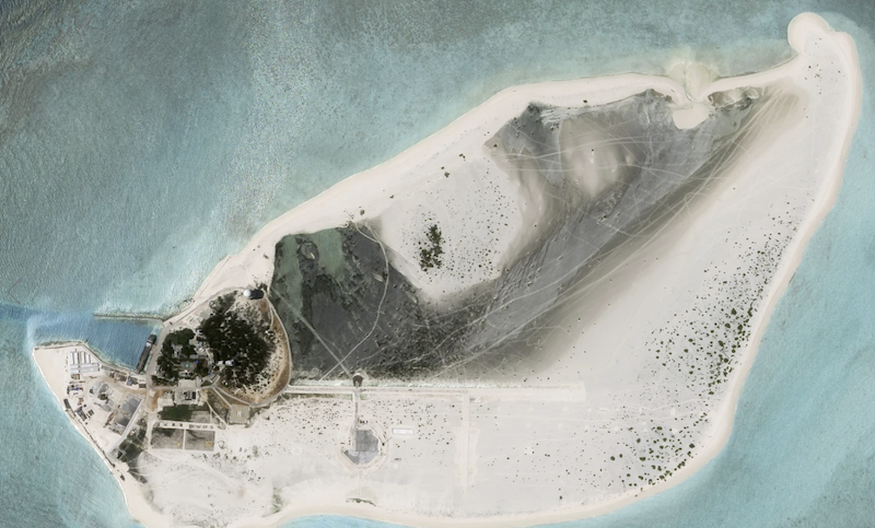 This satellite photo from Planet Labs PBC shows Triton Island in the South China Sea on August 15, 2023, with what appears to be an under-construction airstrip. Planet Labs PBC/AP