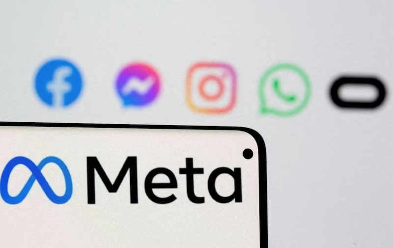 Facebook's new rebrand logo Meta is seen on smartphone in front of displayed logo of Facebook, Messenger, Instagram, Whatsapp and Oculus in this illustration picture taken October 28, 2021. REUTERS/Dado Ruvic/Illustration/File Photo Acquire Licensing Rights