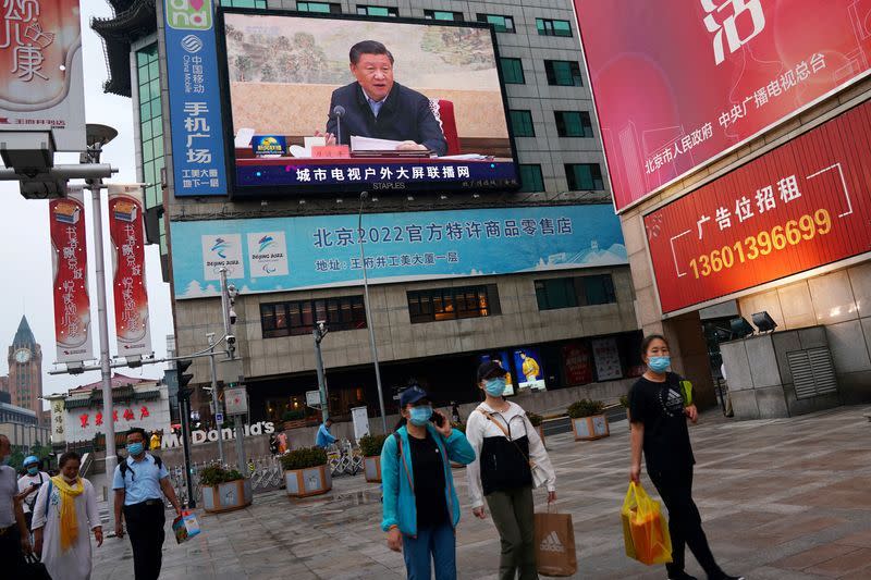 A video of Chinese President Xi Jinping is seen on a big screen in China