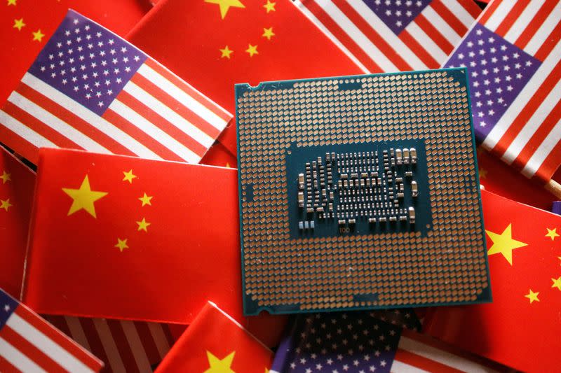 Chinese and US flags are seen with a semiconductor chip