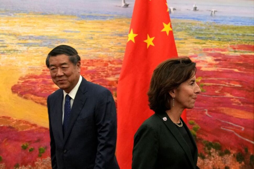 Chinese vice premier He Lifeng, left, is seen with US Commerce Secretary Gina Raimondo at the Great Hall of the People in Beijing