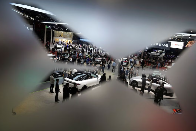 People visit at the XPeng Motors booth at the Auto Shanghai show, in Shanghai, China, April 19, 2023. REUTERS/Aly Song/File photo Acquire Licensing Rights