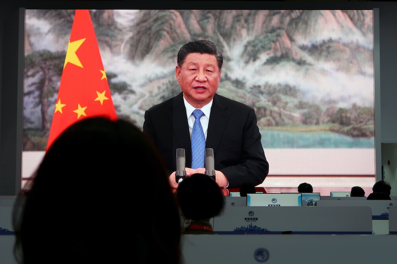 Chinese President Xi Jinping is seen on a big screen at a media centre as he delivers a speech at the opening of the China International Import Expo (CIIE) in Shanghai