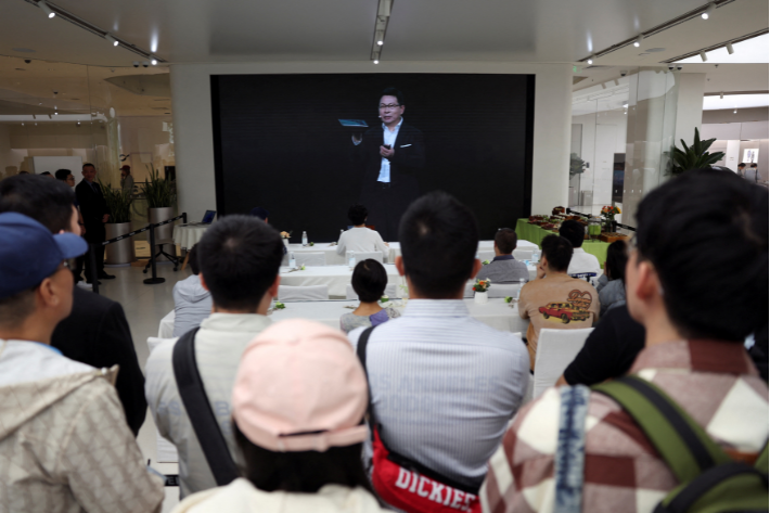 Richard Yu, CEO of Huawei Consumer Business Group, is seen on a screen during the livestreaming of a Huawei launch event at a Huawei flagship store in Beijing, China