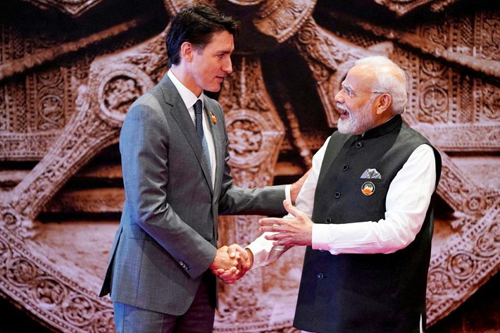 Indian Prime Minister Narendra Modi meets Canada Prime Minister Justin Trudeau upon his arrival at Bharat Mandapam convention center for the G20 Summit in New Delhi