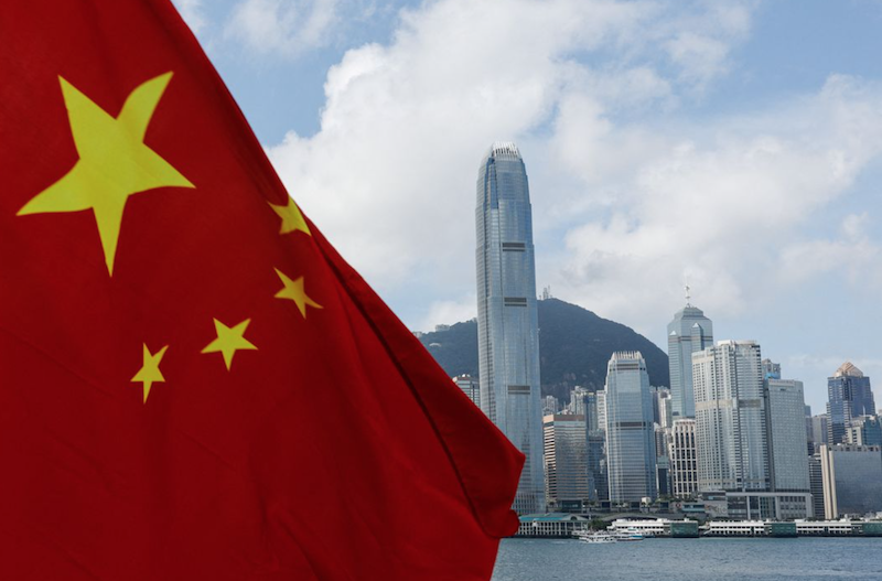 The Chinese national flag is seen in front of the financial district Central on the Chinese National Day in Hong Kong, China October 1, 2022. REUTERS/Tyrone Siu Acquire Licensing Rights