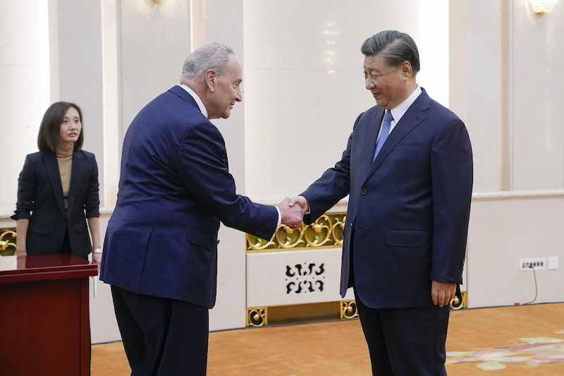 US Senate Majority Leader Chuck Schumer shakes hands with China's President Xi Jinping at the Great Hall of the People in Beijing on Monday.