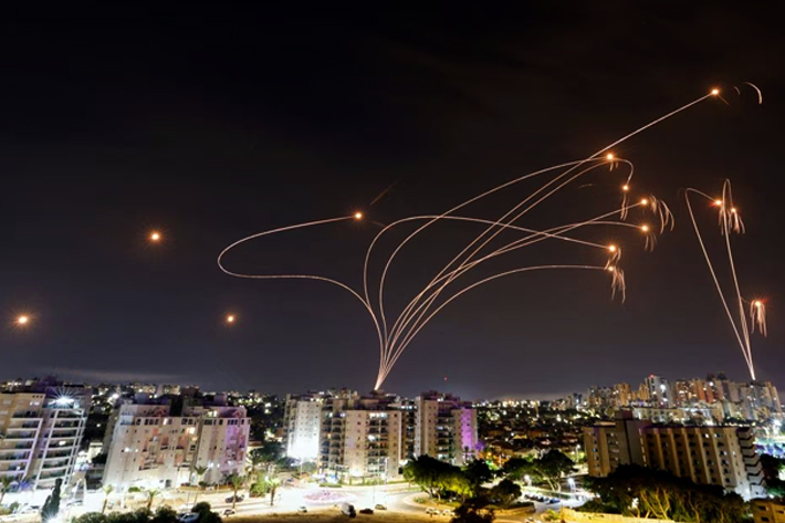 Israel's Iron Dome anti-missile system intercepts rockets launched from the Gaza Strip, as seen from the city of Ashkelon, Israel