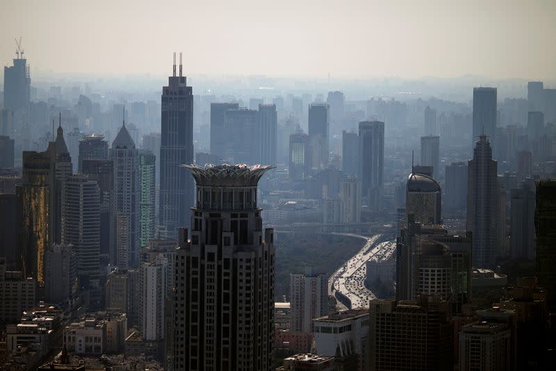 Fitch Cuts China Outlook to Negative, Citing Debt, Growth Risks