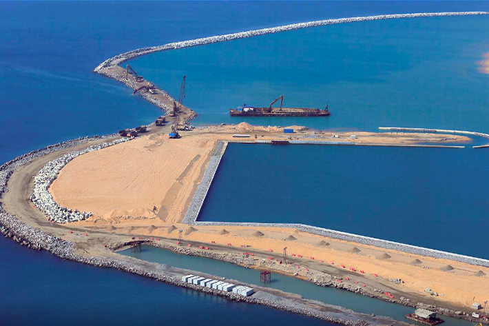 A general view of Colombo Port City construction site, which is backed by Chinese investment is seen through a glass window in Colombo, Sri Lanka