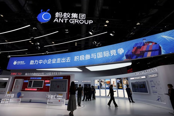 People stand at the booth of Ant Group at the China International Fair for Trade in Services (CIFTIS) in Beijing, China