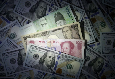 South Korean won, Chinese yuan and Japanese yen notes are seen on U.S. 100 dollar notes in this picture illustration taken in Seoul, South Korea, December 15, 2015. REUTERS/Kim Hong-Ji/File Photo Acquire Licensing Rights