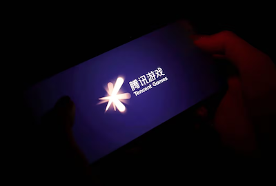 The Tencent Games logo is seen on its game on a mobile phone in this illustration picture taken Aug. 3, 2021. REUTERS/Florence Lo/Illustration/File Photo Acquire Licensing Rights