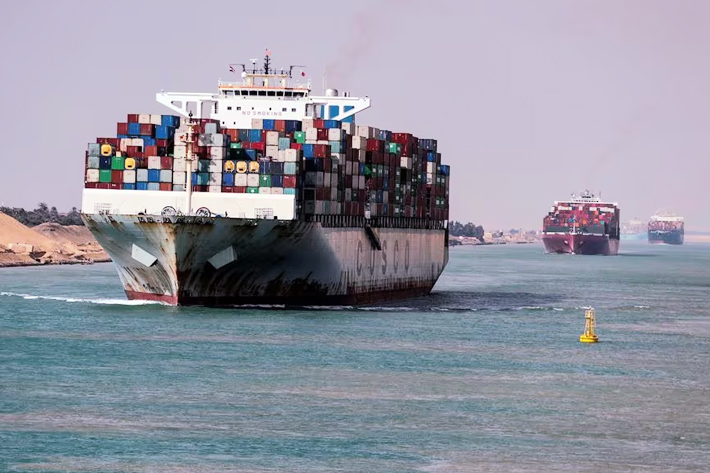 Shipping containers pass through the Suez Canal in Suez, Egypt