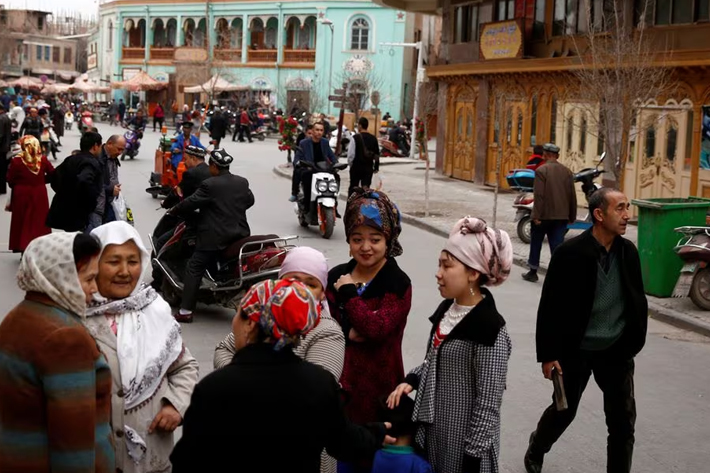 People mingle in the old town of Kashgar, Xinjiang Uighur Autonomous Region, China