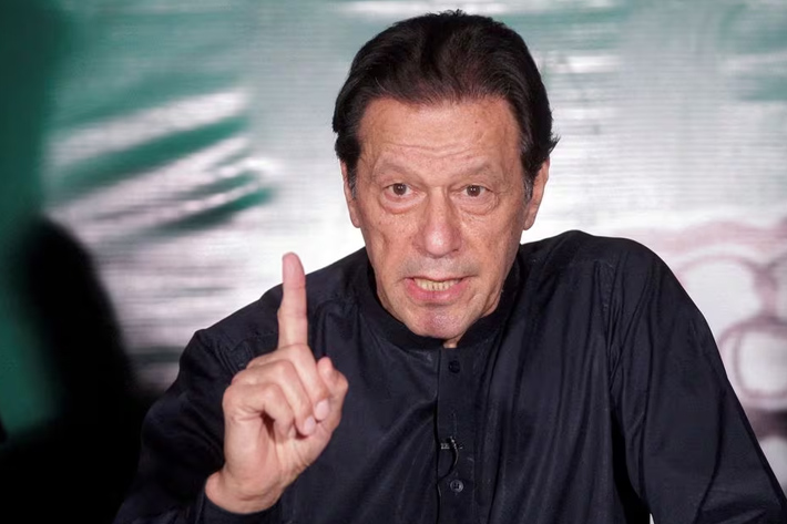 Pakistan's former Prime Minister Imran Khan gestures as he speaks to the members of the media at his residence in Lahore, Pakistan