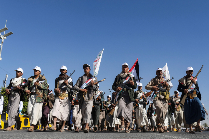 Newly recruited fighters who joined a Houthi military force intended to be sent to fight in support of the Palestinians in the Gaza Strip, march during a parade in Sanaa, Yemen