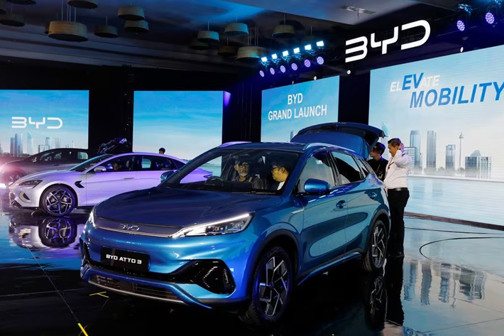 Visitors inspect China's BYD electric vehicles during its launch ceremony in Jakarta, Indonesia