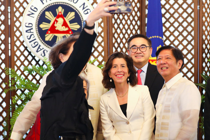 US Commerce Secretary Gina Raimondo poses for a photo next to Philippine President Ferdinand ‘Bongbong’ Marcos Jr during an official event in Manila