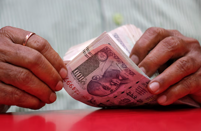 Rupee Plummets to Record Dollar Low, Yuan Pressure Blamed