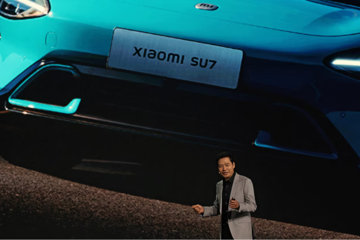 Xiaomi founder and CEO Lei Jun speaks at an event on the company's first electric vehicle (EV) SU7, in Beijing, China