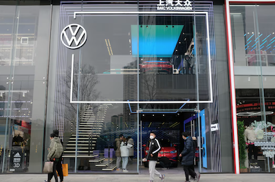 People walk past an ID. Store X showroom of SAIC Volkswagen in Chengdu, Sichuan province, China January 10, 2021. Picture taken January 10, 2021. REUTERS/Yilei Sun/File Photo Purchase Licensing Rights