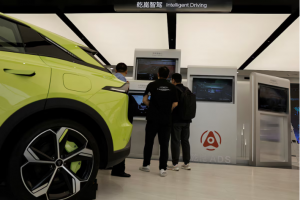 Visitors look at screens that demonstrate Huawei's intelligent driving software Qiankun, at its booth during the Beijing International Automotive Exhibition, or Auto China 2024, in Beijing, China
