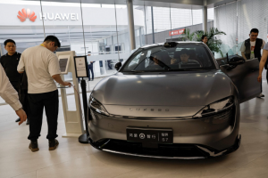 A Luxeed S7 electric sedan, developed by Huawei and Chery Aut, is displayed at Huawei's booth at the Beijing International Automotive Exhibition, or Auto China 2024, in Beijing, China