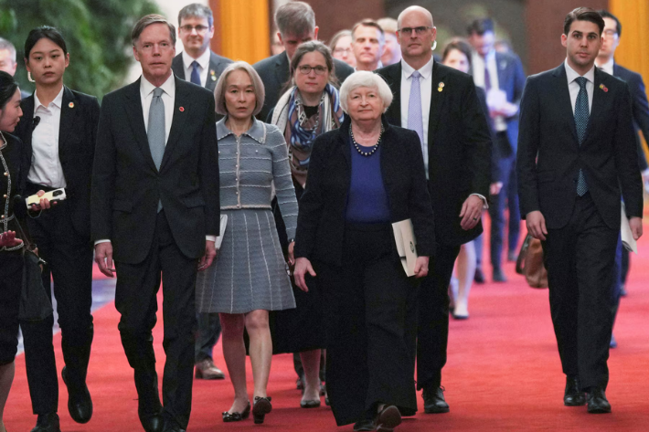 US Treasury Secretary Janet Yellen walks with US ambassador to China Nicholas Burns to attend a meeting with Chinese Premier Li Qiang at the Great Hall of the People in Beijing, China