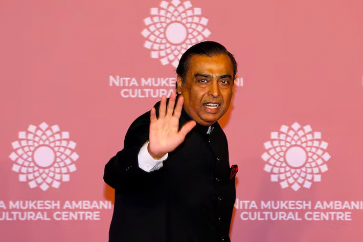 Mukesh Ambani, Chairman of Reliance Industries, waves on the red carpet during the second day of the opening of Nita Mukesh Ambani Cultural Centre (NMACC) at Jio World Centre, in Mumbai.