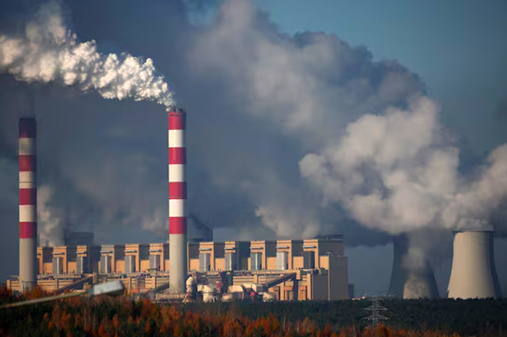Smoke and steam billow from Belchatow Power Station, Europe's largest coal-fired power plant powered by lignite, operated by Polish.