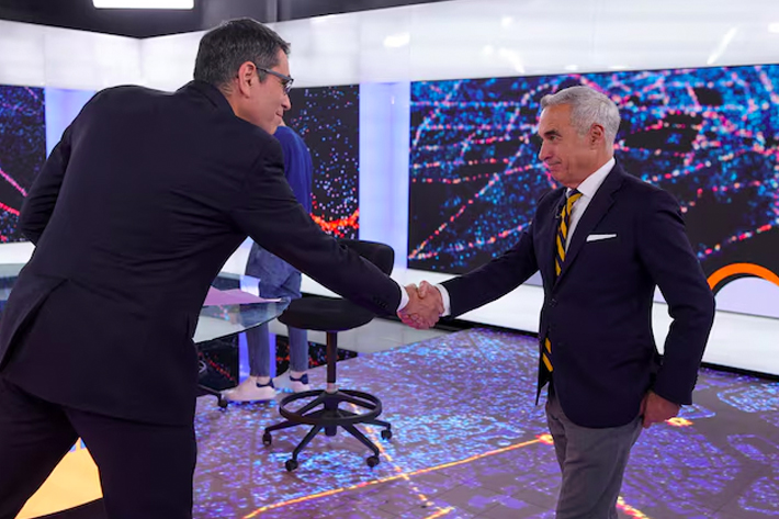 Presidential candidate Calin Georgescu arrives for a televised debate in Bucharest, Romania.