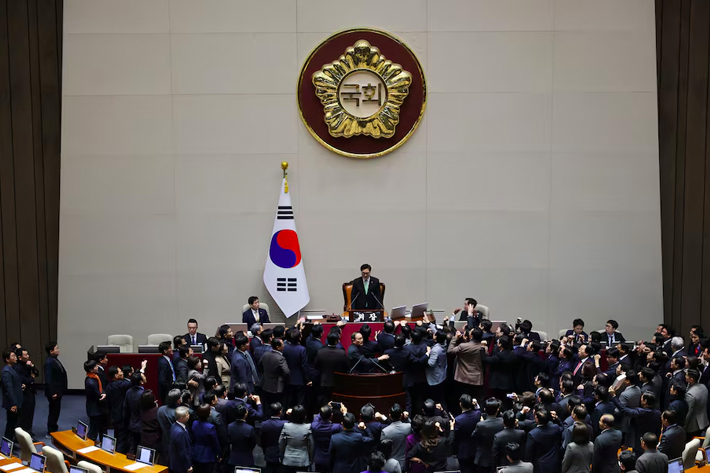 South Korea’s ruling People Power Party lawmakers protest against National Assembly Speaker Woo Won-shik during the impeachment vote of a plenary session for South Korean acting President and Prime Minister Han Duck-soo at the National Assembly in Seoul, South Korea.