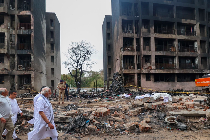 Indian Prime Minister Narendra Modi visits the site where an Air India aircraft, bound for London's Gatwick Airport, crashed during take-off from an airport in Ahmedabad, India